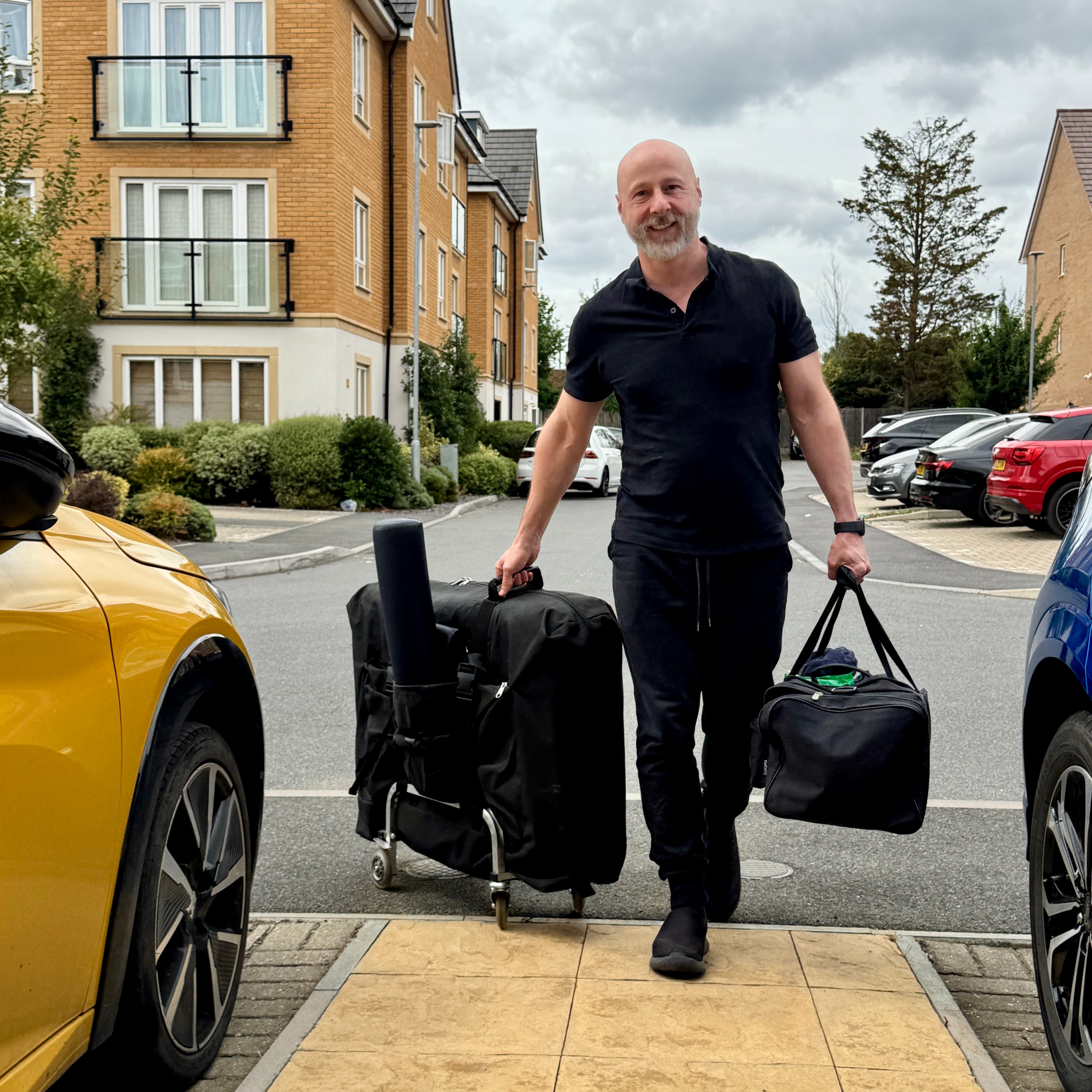 Paul arriving at a client's home with professional massage equipment